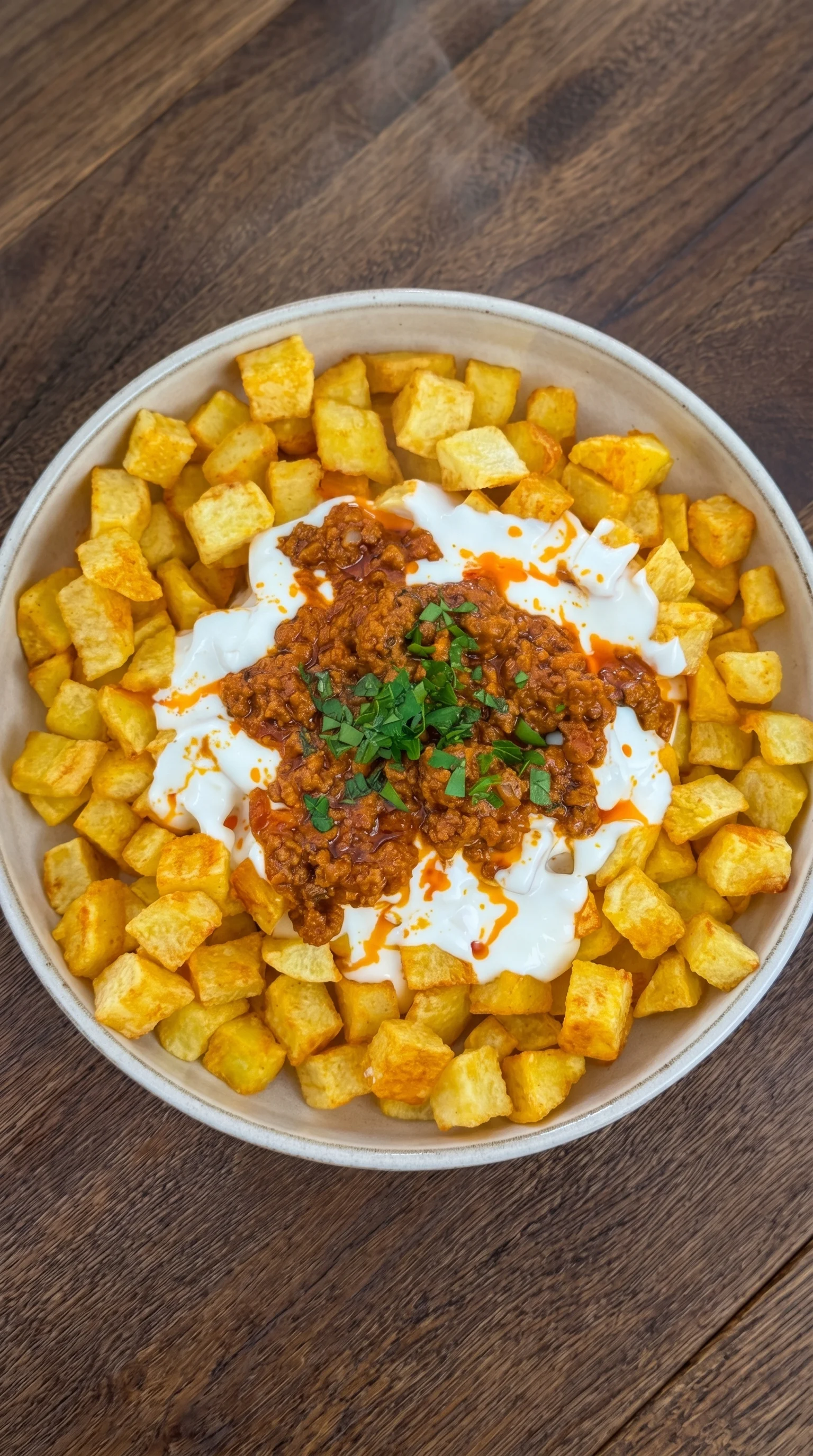 A bowl of food with a spoon in it.