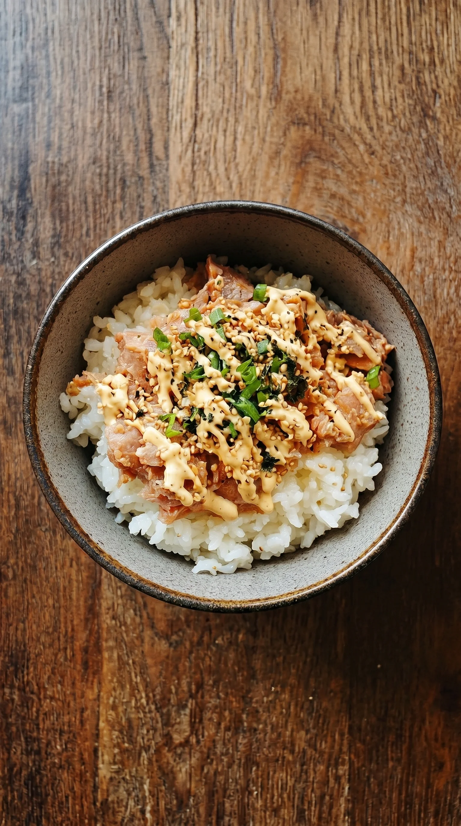 A bowl of food with a sauce on top.