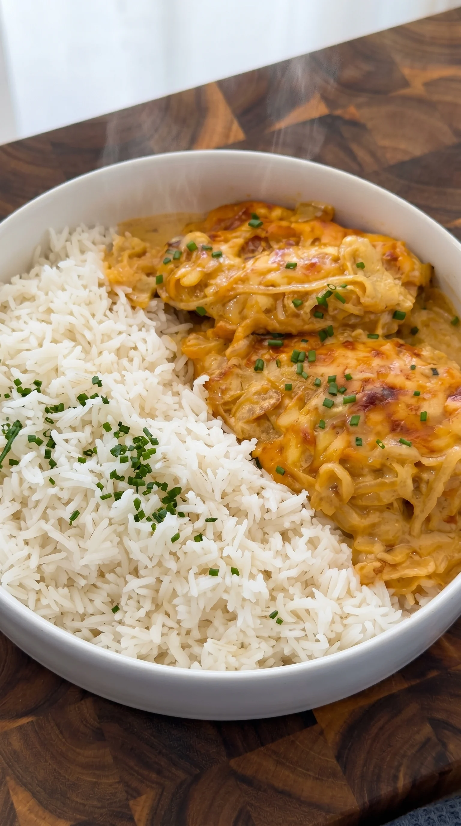A bowl of rice and chicken.