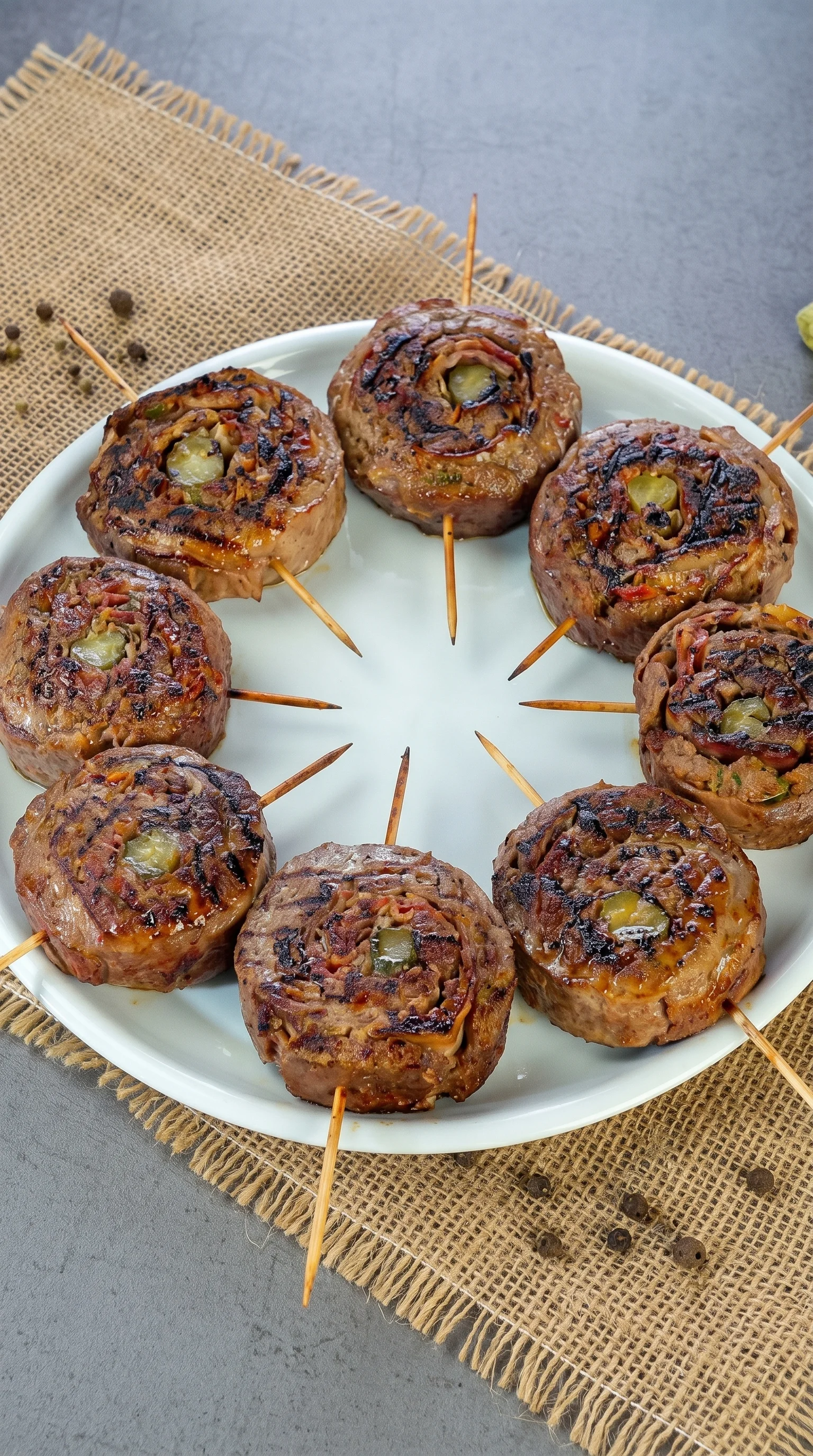 A plate of meat on a stick.