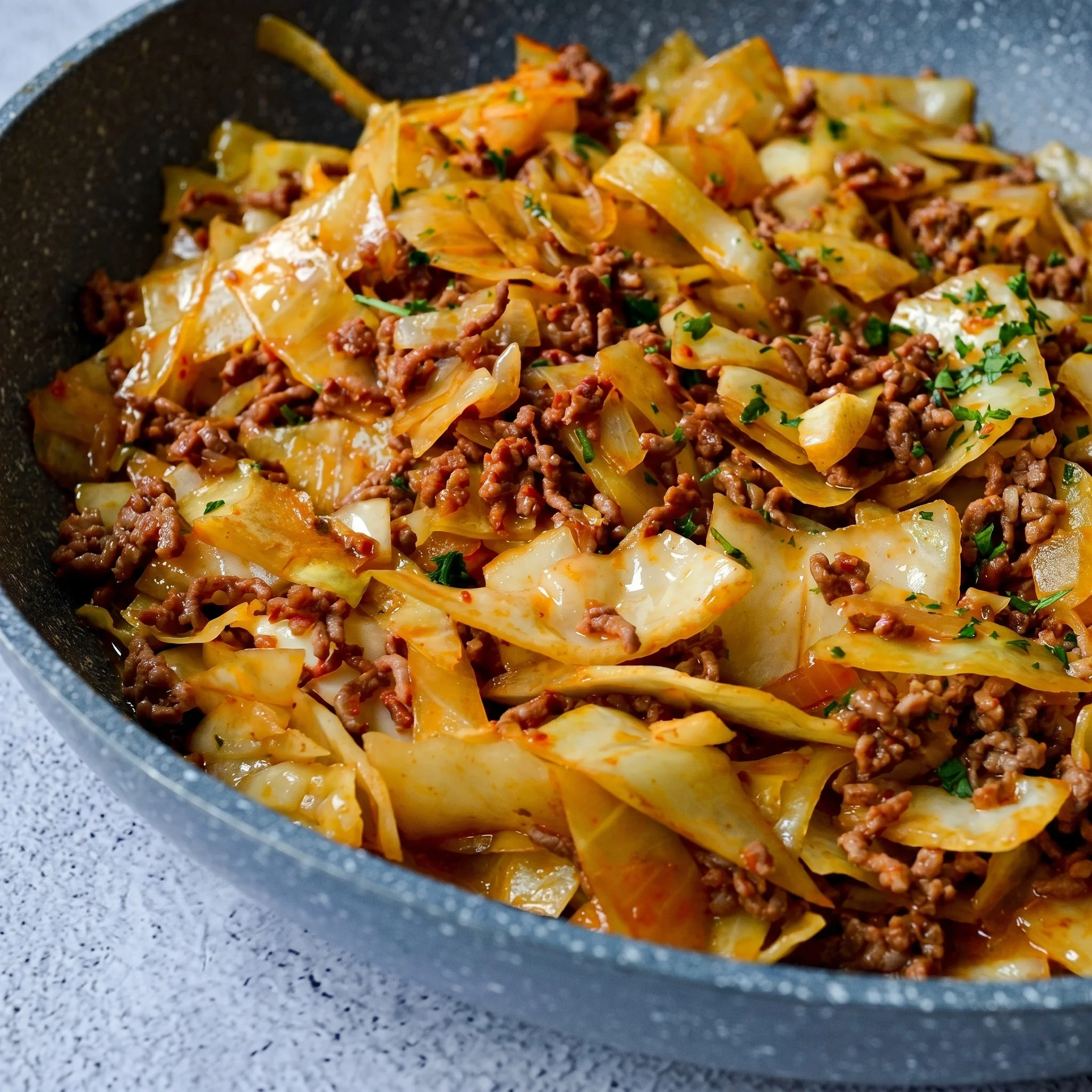 A bowl of meat and vegetables.